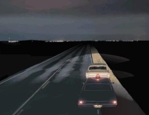 70s police cruiser stopping a car on a late night highway