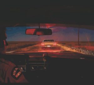 From a constable's vehicle, you see a car stopped late at night on a Saskatchewan highway.